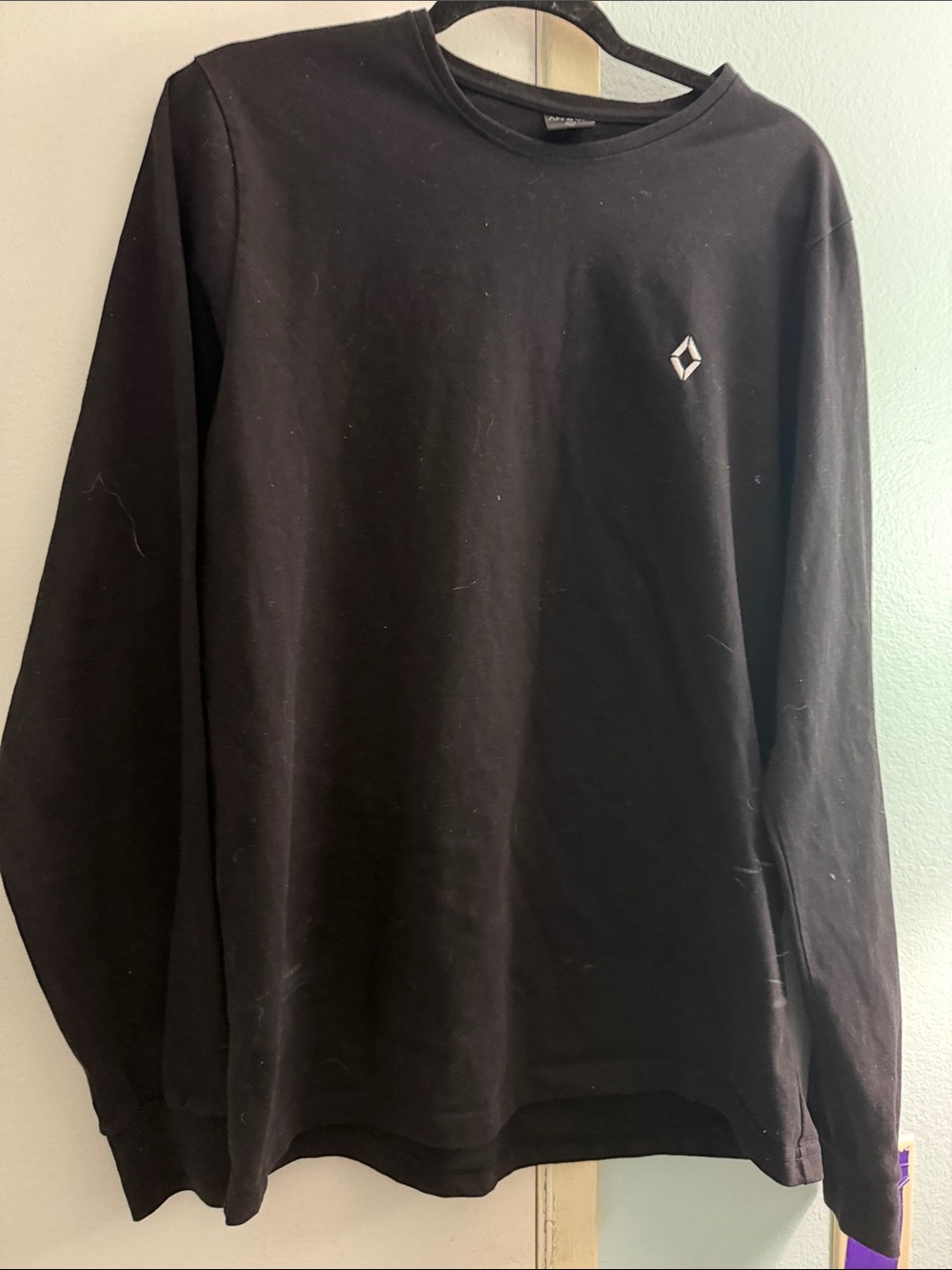 Classic Black Crewneck Sweater with Diamond Chest Emblem